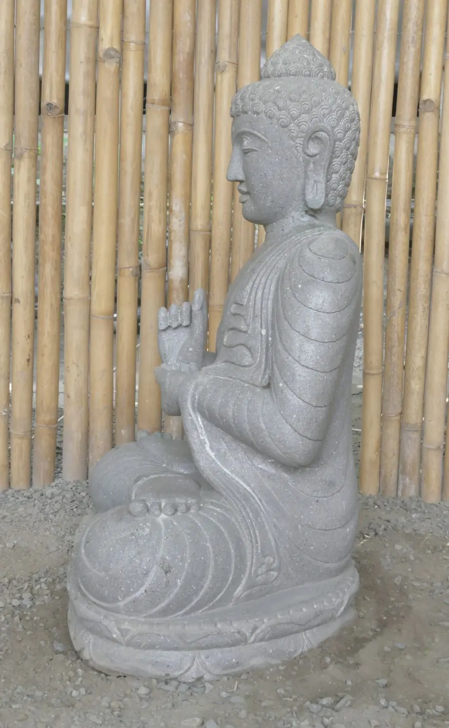  Product image 6 of the product “Seated Buddha made of Riverstone in Dharmachakra gesture of wheel of the teaching of the Dharma, H. 83cm. There is a stone eye on the left shoulder. ”